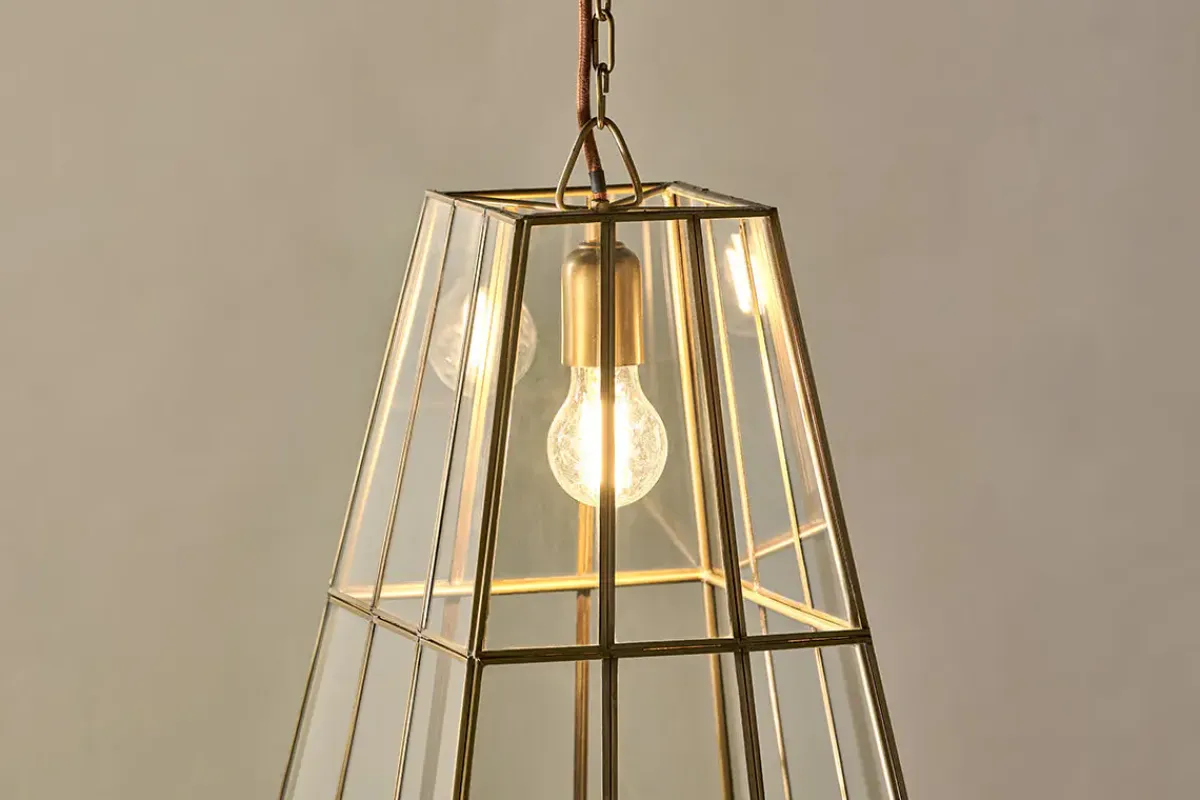 Statement Lighting|Pendant Lighting^Nkuku Solan Glass Lantern Pendant - Clear & Antique Brass